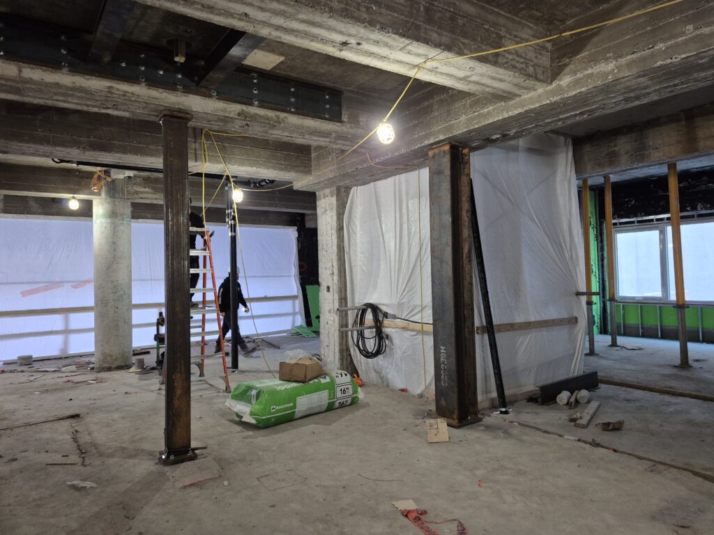 Temporary steel shoring and post installation inside reinforced concrete structure